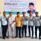 Dewan Muhammad Rizal saat foto bersama masyarakat.