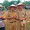 Camat Cucu Abdurrosyied bersama jajaran Polresta Tangerang saat ikut panen jagung.