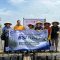 Karyawan PT BSI bersama masyarakat menanam mangrove di pesisir Desa Marga Mulya, Mauk, Tangerang, Kamis (30/4/2026), sebagai upaya mencegah abrasi dan memulihkan ekosistem pantai melalui program BSI Peduli.