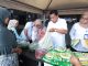Bupati Maesyal, Kepala Disperindag Kabupaten Tangerang, Resmiyati Marningsih, saat melayani warga yang ikut kegiatan Warteksi Gemilang.