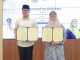 Pilar Saga Ichsan saat penandatanganan kesepakatan bersama antara Pemkot Tangsel dan BSI terkait pemanfaatan produk dan layanan perbankan syariah.