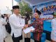 Bazar HUT ke-26 Banten, Sekda Deden Serahkan NIB dan Sertifikat Halal untuk UMKM